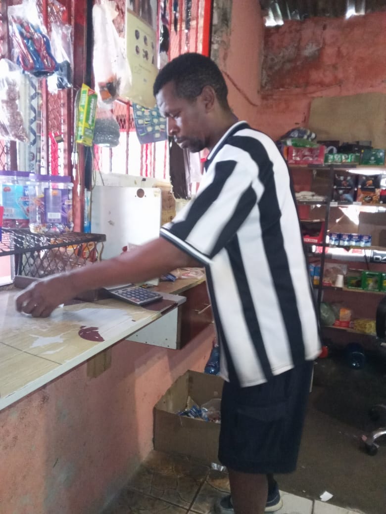 kcoefficient Friendly staff assisting customers.